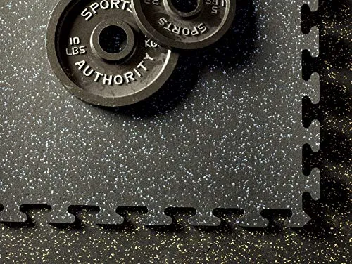 Heavy-duty rubber gym flooring tiles laid out under a home power rack