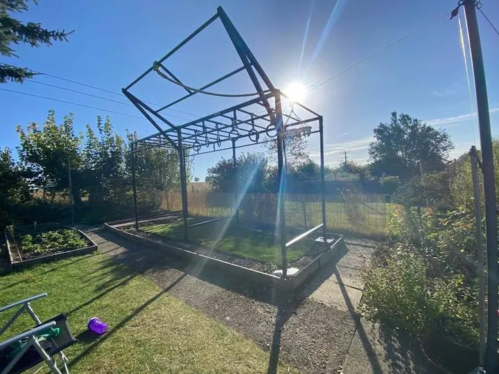 Owen Hayes's outdoor home gym in Melbourne — climbing ropes, rings and a pull-up bar.
